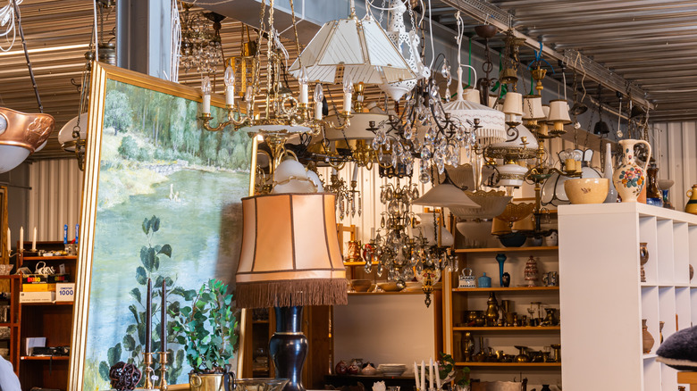 Interior of antique shop carrying lamps, trinkets, and art