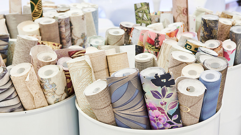 Barrels of printed wallpaper rolls