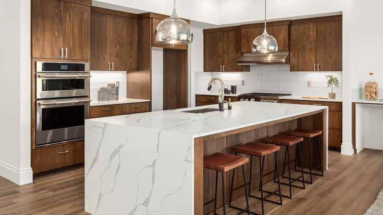 Luxury white and brown kitchen with island