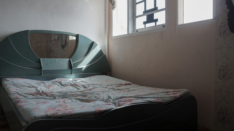 old mattress by window