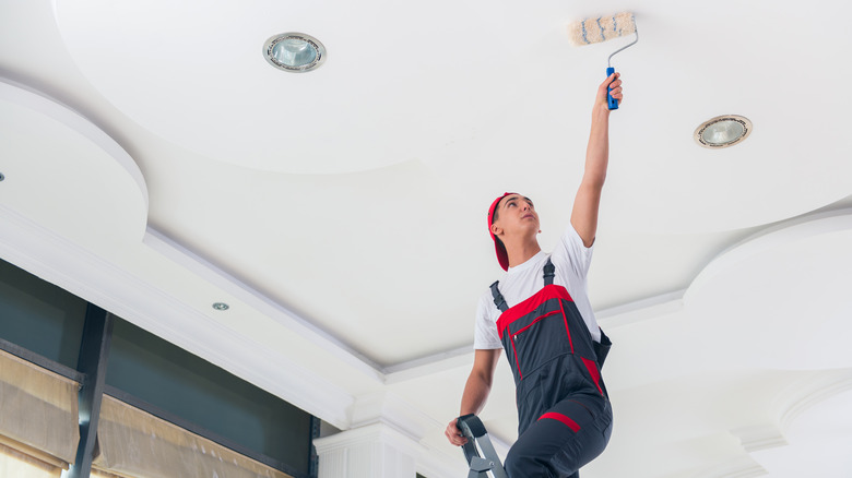 Person painting ceiling