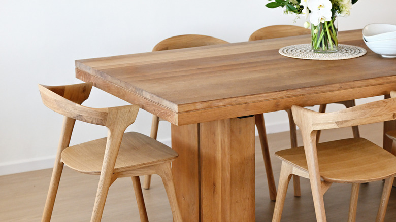 Wooden kitchen table with flowers