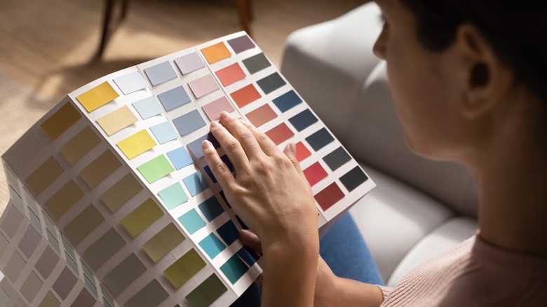 woman looking at paint samples