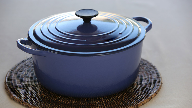 Blue Dutch oven on trivet