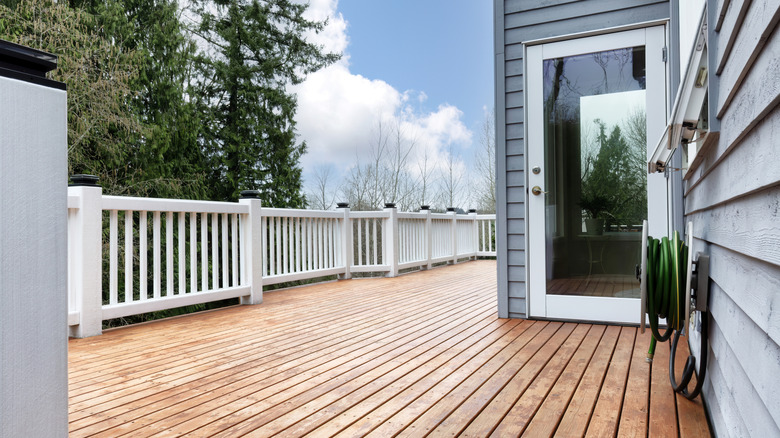 Freshly stain large home walk out cedar wood deck patio