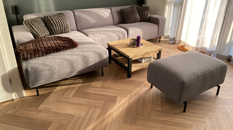 living room with herringbone floors 