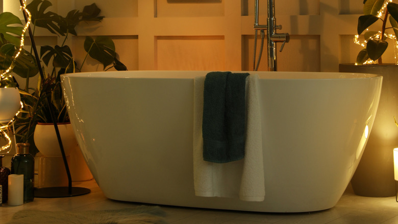 Bathtub in a bathroom with warm lighting