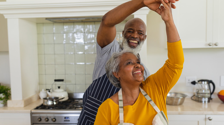 black couple happy in kitchen
