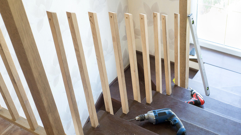 A staircase in the middle of a railing renovation