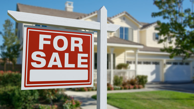 Real estate agent with young couple