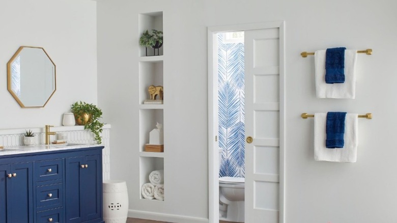 bathroom with pocket doors to toilet area
