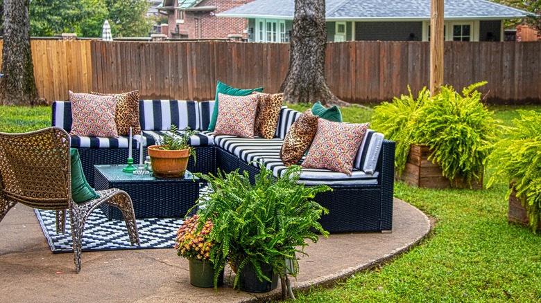 Fenced in backyard with seating area