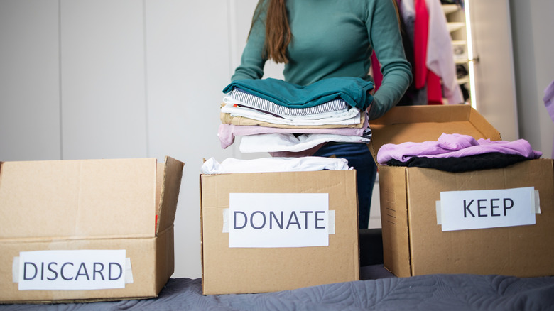 Boxes labeled for donating, keeping, discarding