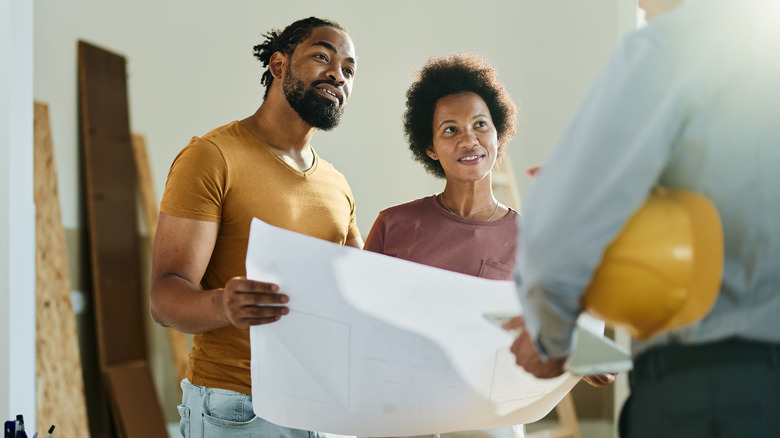 Couple speaking to contractor