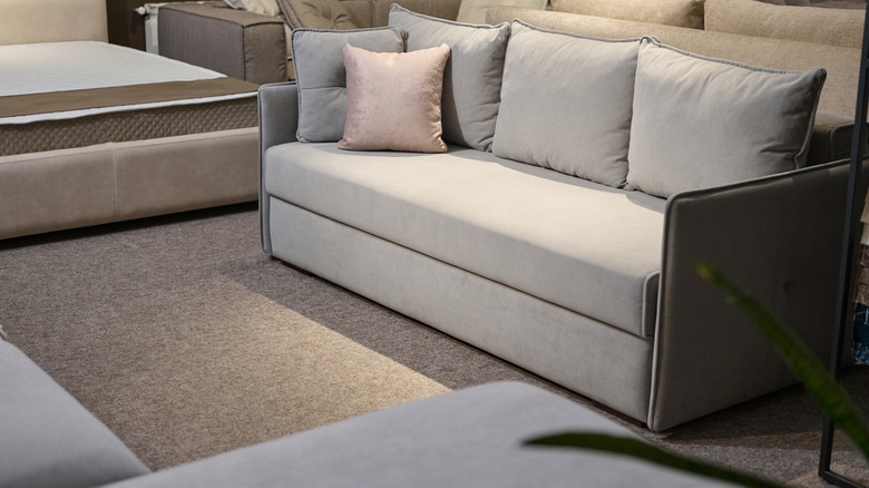 Light gray couch in a furniture showroom
