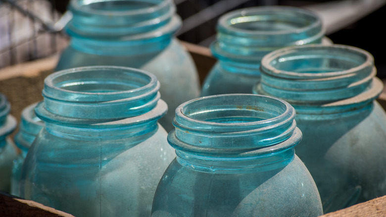 blue jars in a crate