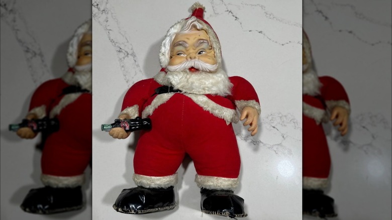 A Rushton Santa Clause Coca-Cola doll.