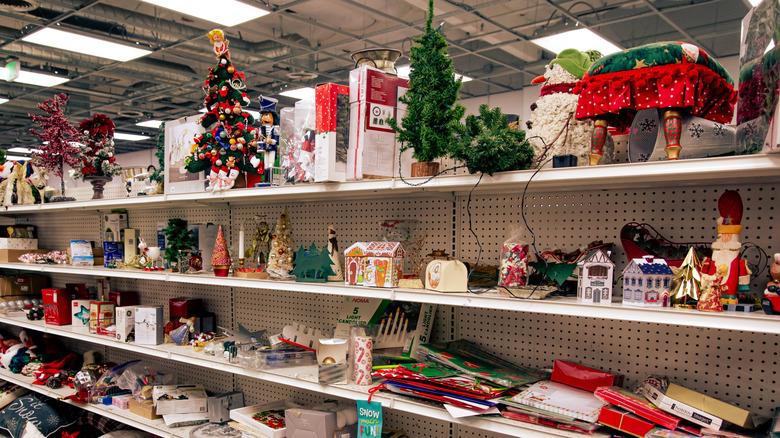 A thrift store aisle with different Christmas decor.