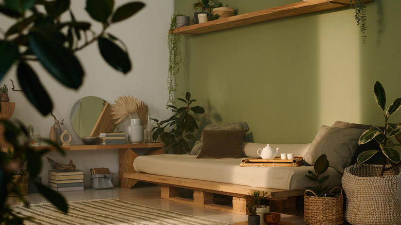 A home interior with biophilic design traits such as earthy tones, wood accents and plants
