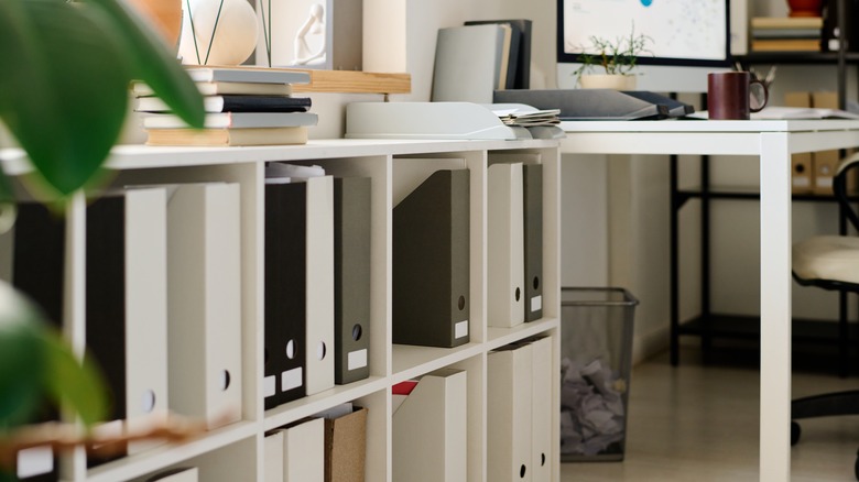 An open shelf unit in a home office