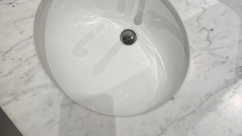 Marble sink with a polished nickel faucet