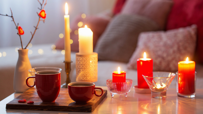 An assortment of candles in different holders