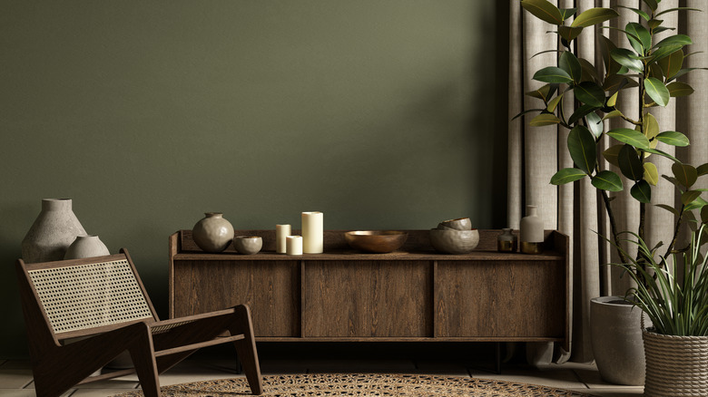 Modern interior with a green wall and plants.