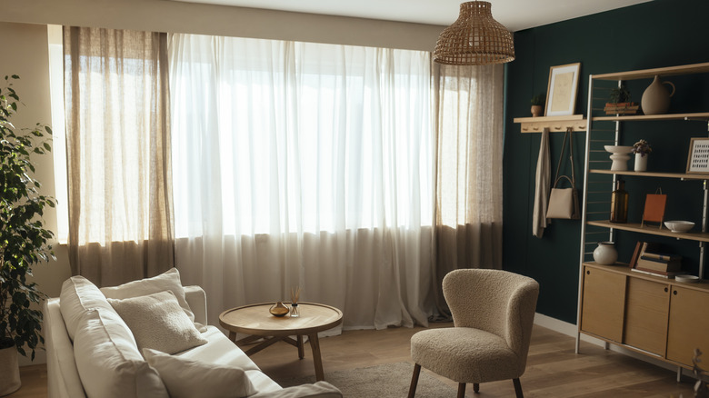Living room with layered floor to ceiling curtains