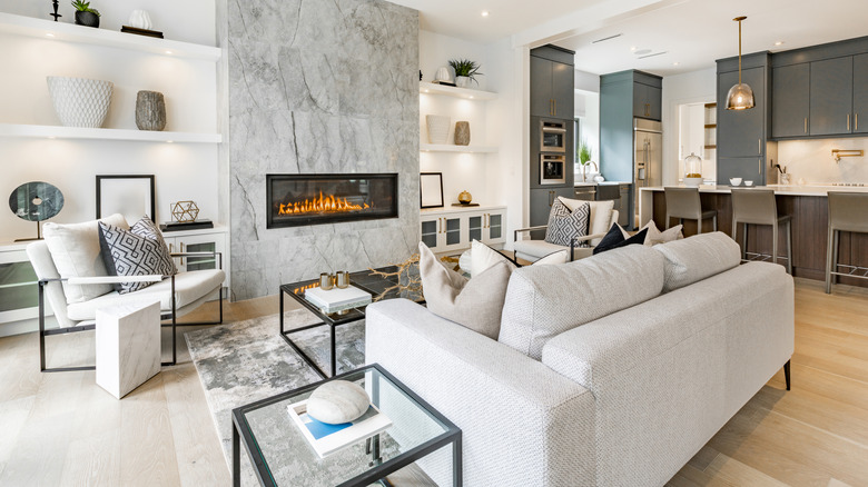 two green acccent chairs and leather lounger in living room