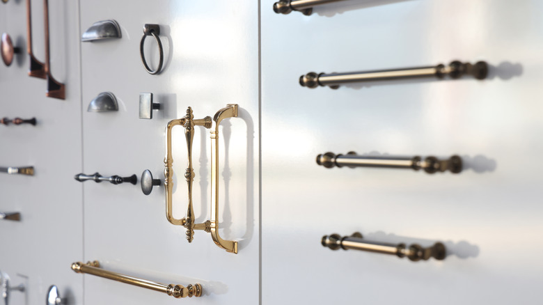 Varying styles of kitchen hardware including door pulls and handles