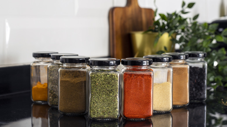 A collection of spice jars on the counter