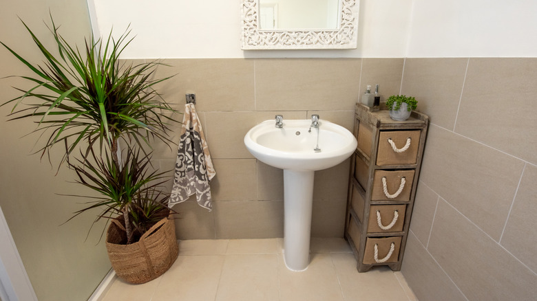 Bathroom with grey tile on walls