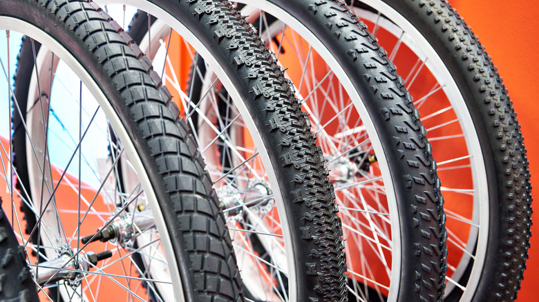 A row of bike tires with different treads