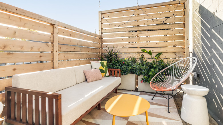 Enclosed terrace with modern rug