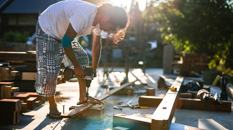 Someone working on an outdoor DIY