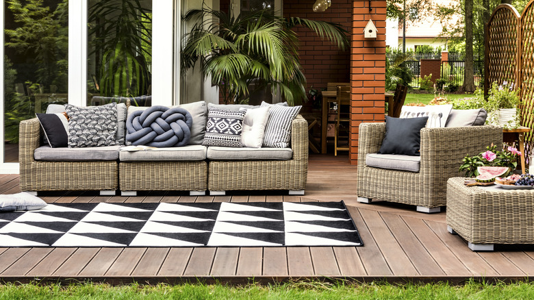 A patio with an area rug