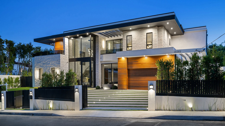 A well-lit modern two-story home exterior