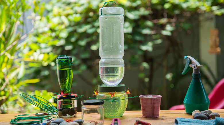 Craft supplies on table for DIY hummingbird feeder
