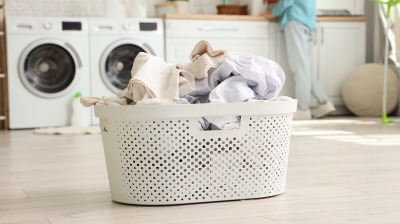 Laundry basket filled with dirty clothes