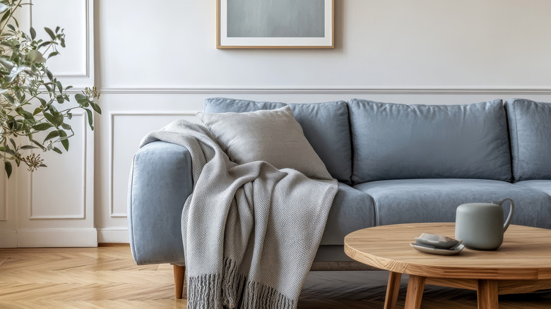 Gray blanket draped on couch