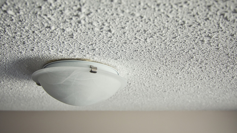 popcorn ceiling texture with ceiling light fixture