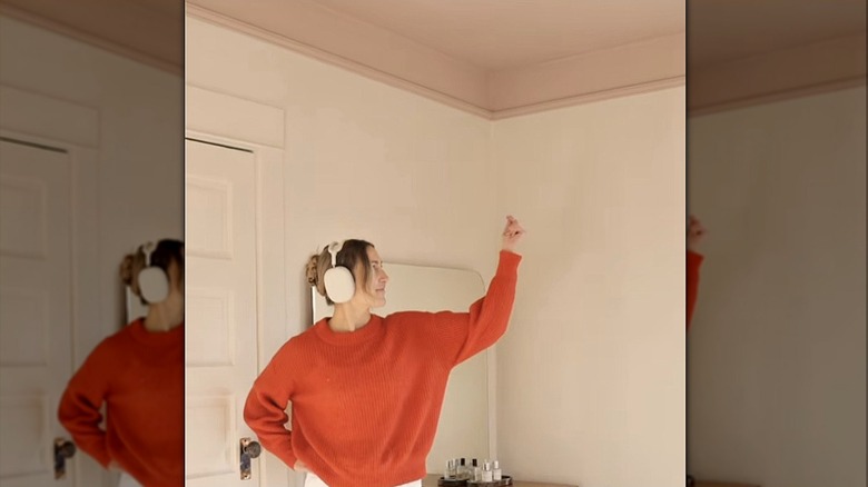 woman showing accent ceiling with trim