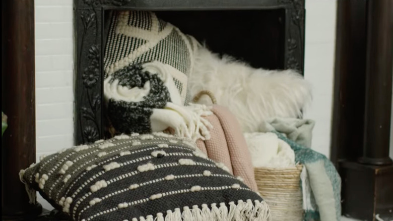 blankets piled up in fireplace