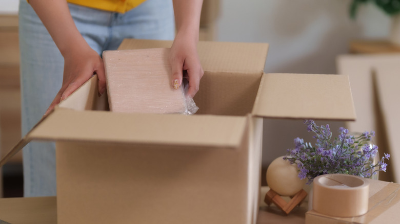 Woman packing empty boxes