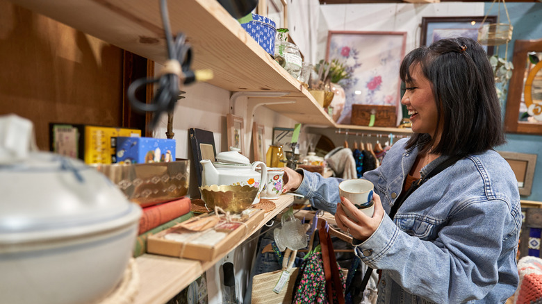 A woman thrift shopping by herself