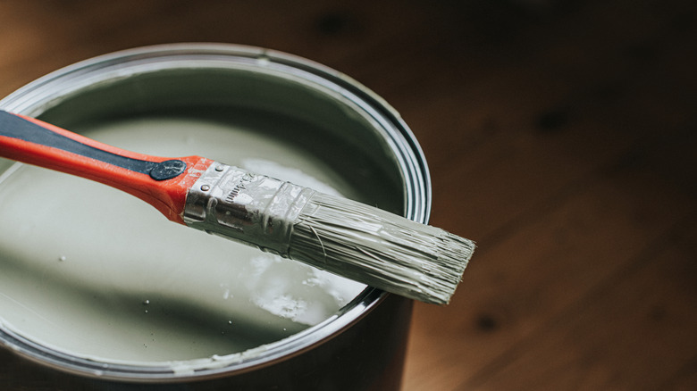 Paint brush in paint can