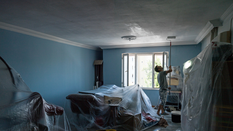Person painting ceiling