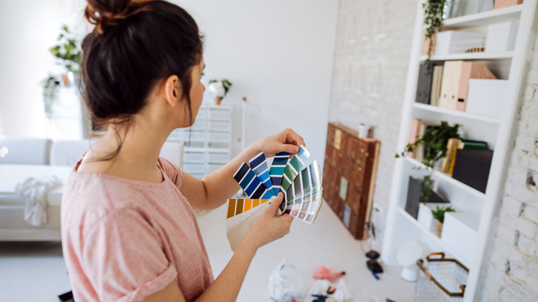 woman looking at paint swatches
