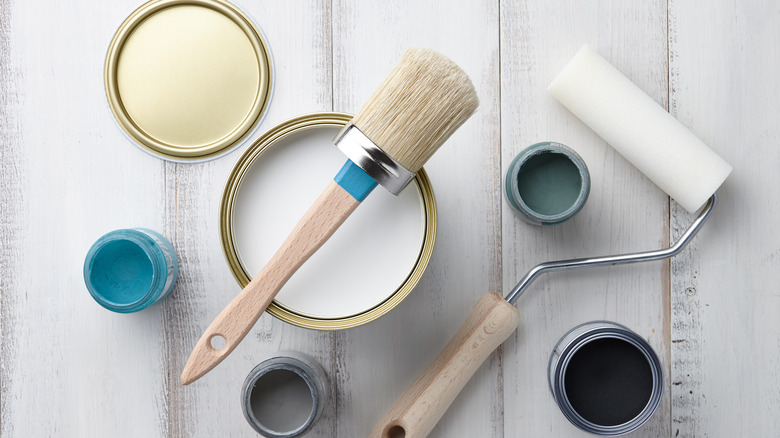 Paint roller, brush and cans