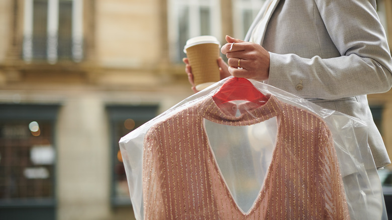 Person picking up dry cleaning